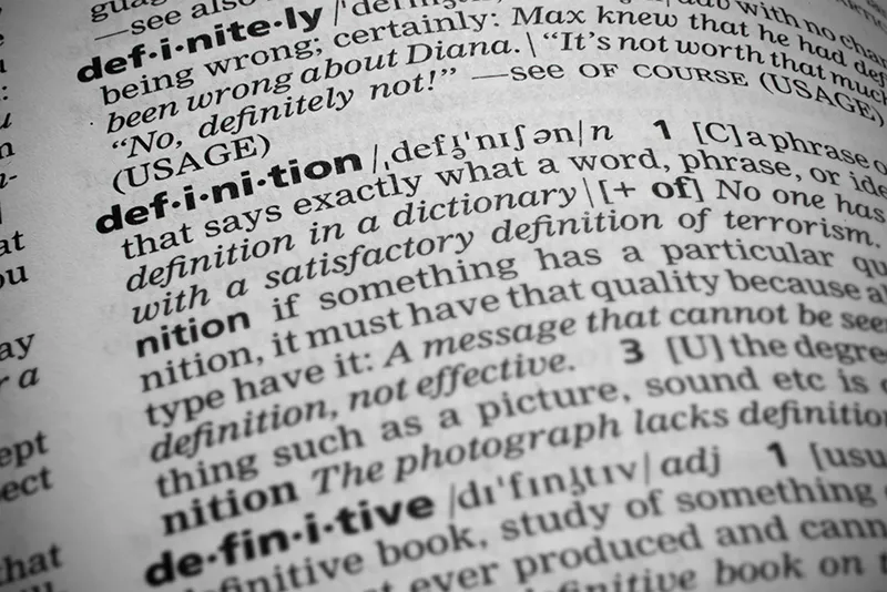A dictionary with the word definition highlighted
