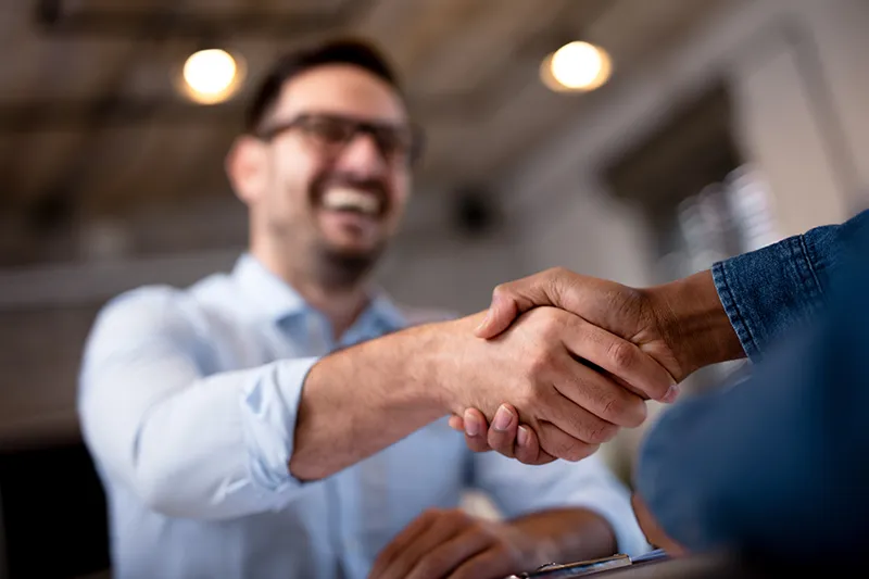 Man shaking hands with an injury lawyer