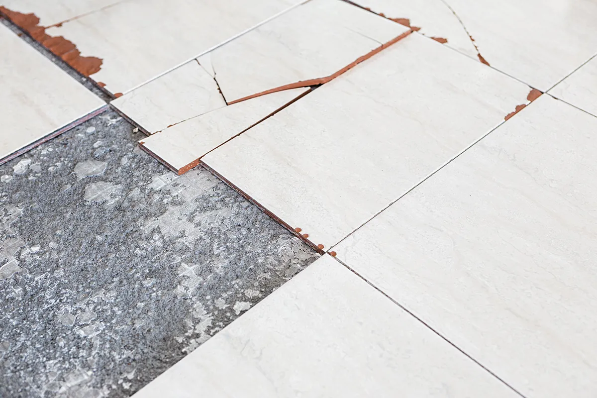Asbestos floor tiles being removed