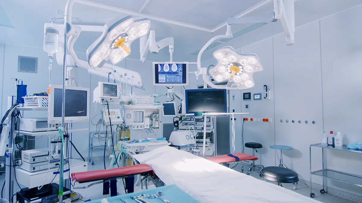 Operating room with equipment and booms