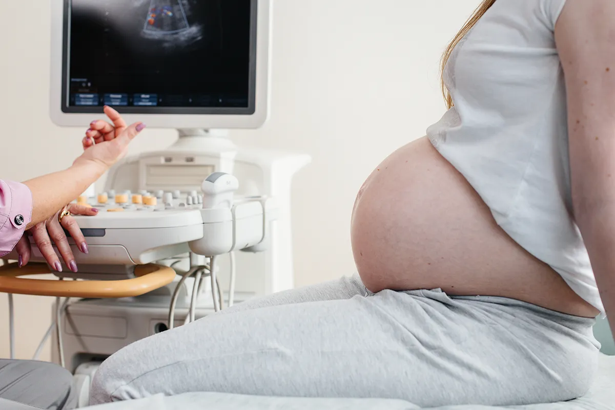 Pregnant woman getting sonogram