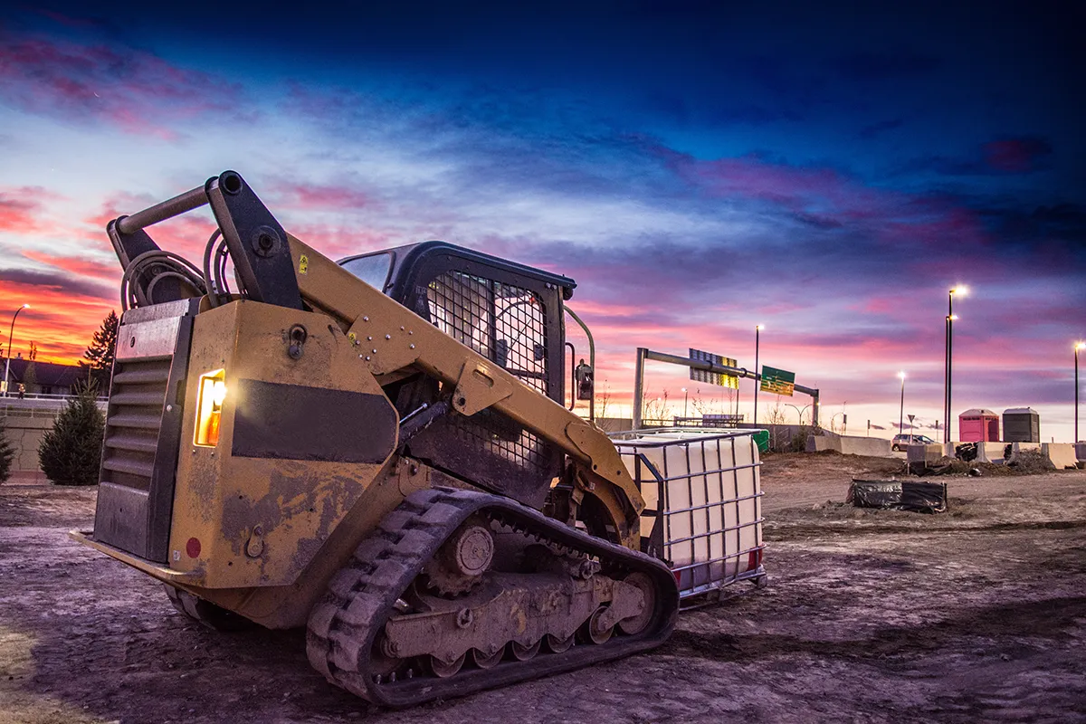 Skid steer on worksite